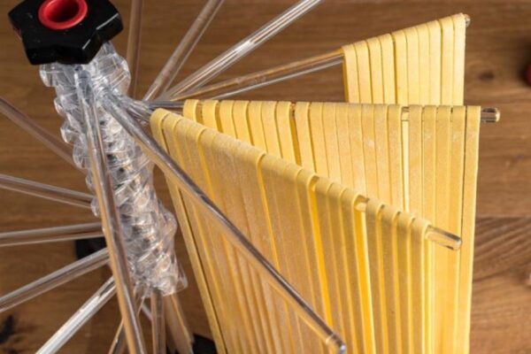 Marcato Tacapasta pasta drying rack holding fresh homemade pasta strands