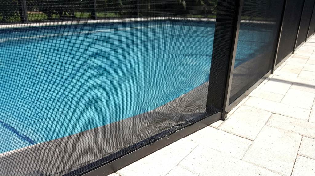 Protective window film reducing sunlight on pool screen structure